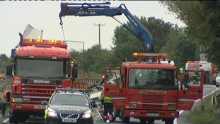 Salvage crews clear away the wreckage