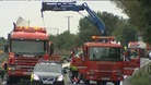 Salvage crews clear away the wreckage