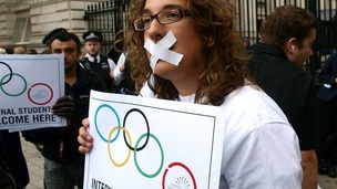 London Metropolitan University students protest outside Downing Street, central London, to express their distress and anger at the UKBA