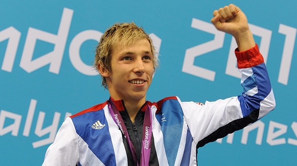 Jonathan Fox celebrates after winning gold in the Men's 100m Backstroke.