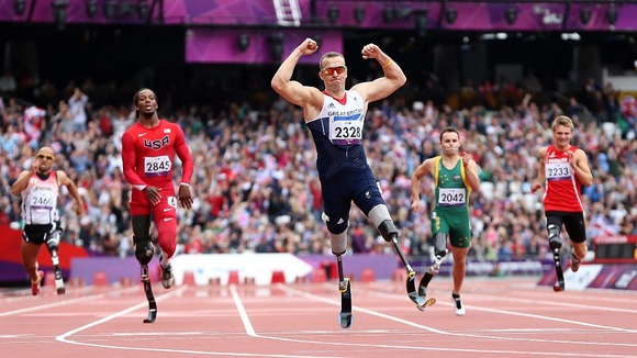 Nottingham's Richard Whitehead celebrates winning the Men's 200m - T42