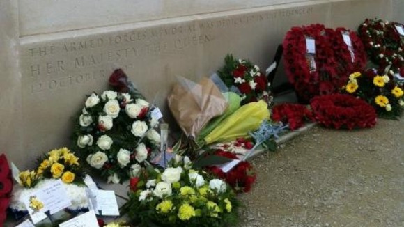 Flowers and wreaths laid in memory of loved ones