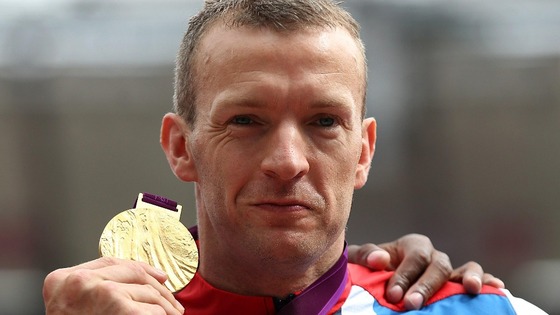 Great Britain's Richard Whitehead receives his Gold medal after winning the Men's 200m - T42 