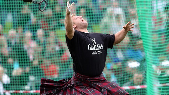 Scott Rider competes in the heavyweight competition at the Braemar Gathering.