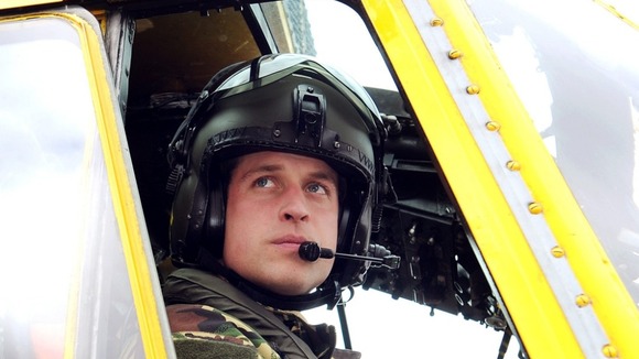 Prince William sits at the controls of a Sea King helicopter