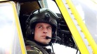 Prince William sits at the controls of a Sea King helicopter