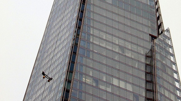 Prince Andrew begins the abseil earlier today.