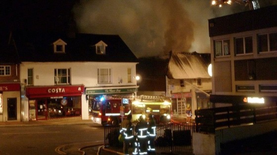 Firefighters stand back as the blaze is bought under control 