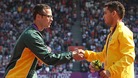 Oscar Pistorius shakes hands with gold medalist Alan Fonteles Cardoso Oliveira today at the Olympic Stadium