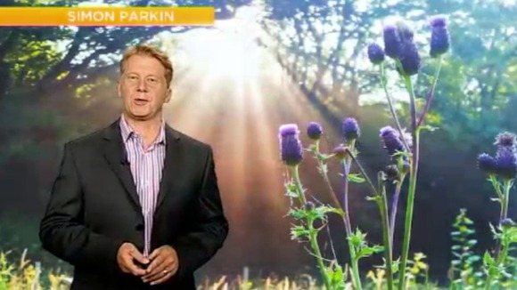 Simon Parkin in front of weather photo