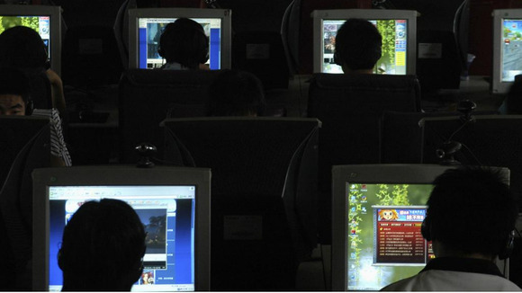 People use computers at an Internet cafe in Changzhi, north China's Shanxi province