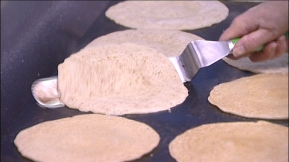 Oatcakes being flipped in the Hole in the Wall