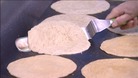 Oatcakes being flipped in the Hole in the Wall