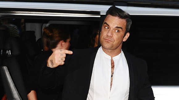 Robbie Williams arrives at the awards.