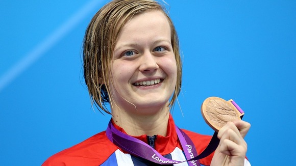 Great Britain's Hannah Russell on the podium after winning the bronze medal in the Women's 100m Butterfly.