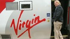 Sir Richard Branson boarding a Virgin train