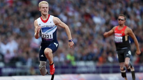 Jonnie Peacock wins his heat during the Men's 100m - T44 heat