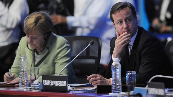 David Cameron and German Chancellor Angela Merkel attend the G20 Summit in Mexico.