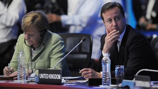 David Cameron and German Chancellor Angela Merkel attend the G20 Summit in Mexico.