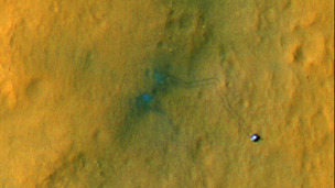 Tracks from the first drives of NASA's Curiosity rover are visible