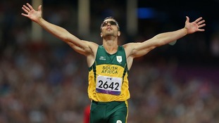 South Africa's Oscar Pistorius celebrates winning Gold in a new Paralympic Record time during the Men's 400m - T44 Final