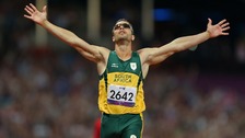 South Africa's Oscar Pistorius celebrates winning Gold in a new Paralympic Record time during the Men's 400m - T44 Final 