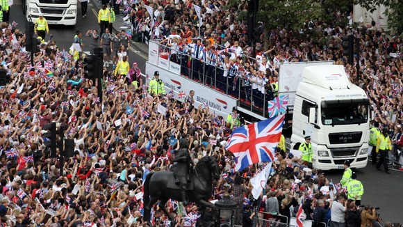 The crowd in Trafalgar Square cheer on the athletes.