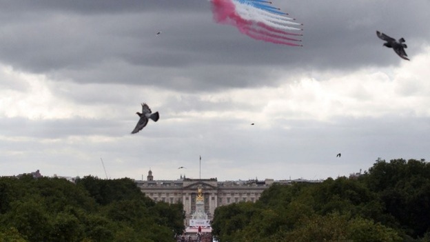 The famous red, white and blue smoke in the sky over central London watched by thousands
