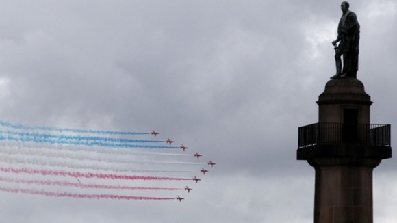 The Red Arrows fly past London's landmarks 