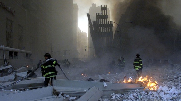 Firemen work around the World Trade Center after both towers collapsed in New York on September 11, 2001
