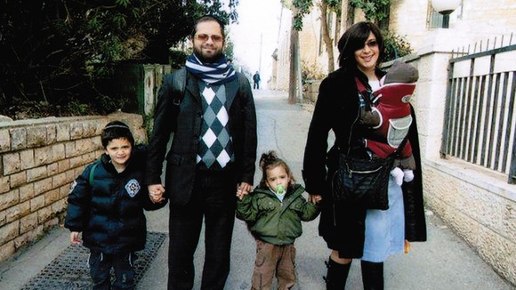 Jonathan Sandler pictured with his sons Gabriel and Arieh and his wife Eva and baby daughter