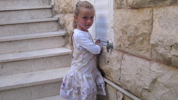 Eight-year-old Miriam Monsonego, daughter of school headmaster Rabbi Yaacov