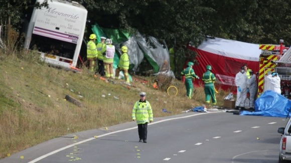 Emergency services at the scene the coach crash on the A3 near Hindhead in Surrey.