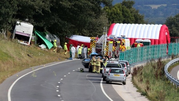 Emergency services at the scene the coach crash on the A3 near Hindhead in Surrey.