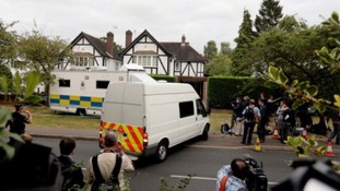 Surrey Police outside the home of Saad Al-Hilli in Claygate on Monday.