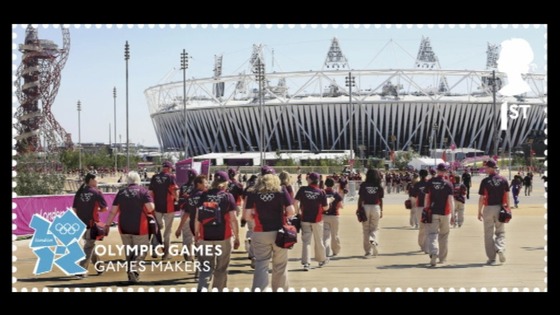 Stamp design with Games Makers in front of the Olympic Stadium.
