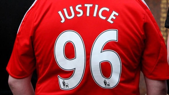 Fan pays tribute at the Hillsborough Memorial in Liverpool.