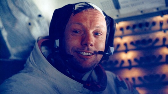 Neil Armstrong smiles in the lunar module after his historic moonwalk