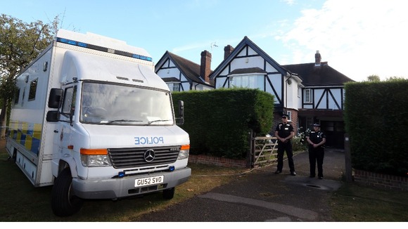 Surrey Police outside the home of Saad Al-Hilli in Claygate, Surrey.