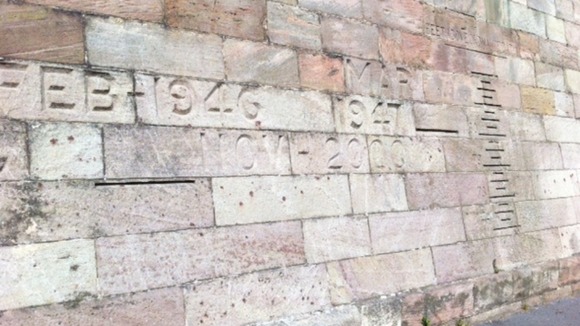 Markings on Trent Bridge showing the extent of past flooding in Nottingham