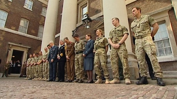 Troops gathered at Admiralty House to receive their honours.