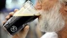 A real ale fan sups a pint