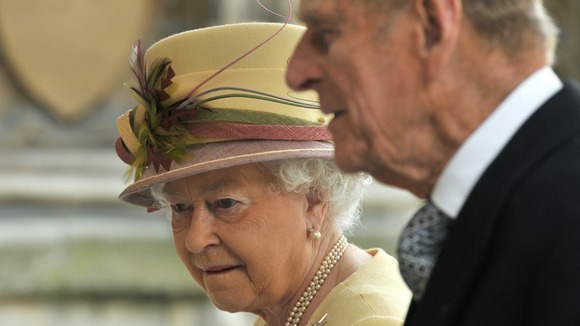 Queen Elizabeth arrives with Prince Philip to address both Houses of Parliament at Westminster Hall in London March 20