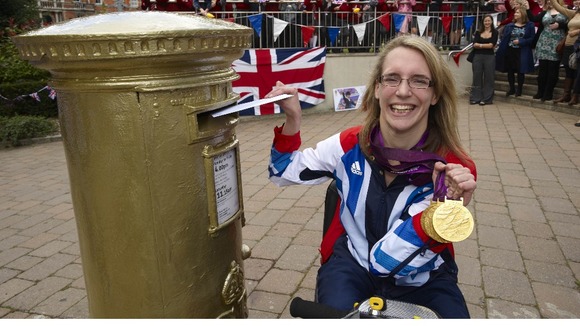Sophie Christiansen next to gold postbox.