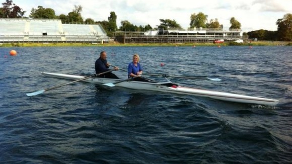 Sir Steve Redgrave rowing with London Tonight reporter Emma Walden.