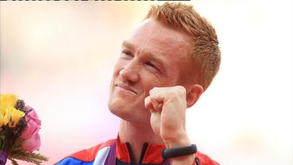 Olympic champ won't be at victory parade