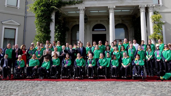 Members of Ireland's Paralympic team pose for a group picture alongside government officials.