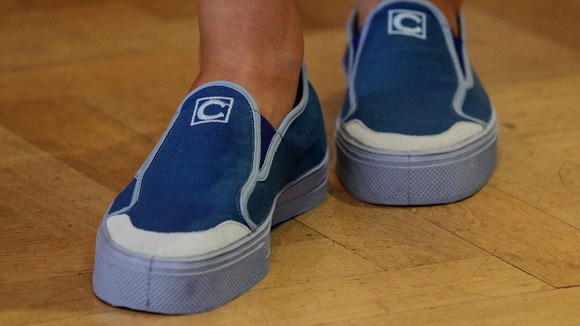 A model wearing shoes designed by Christopher Ciccone