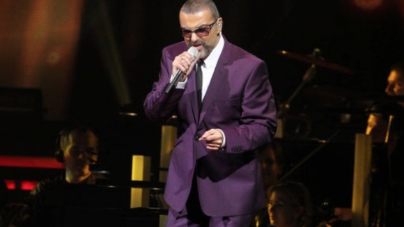 George Michael performs during his 'Symphonica' tour in Vienna