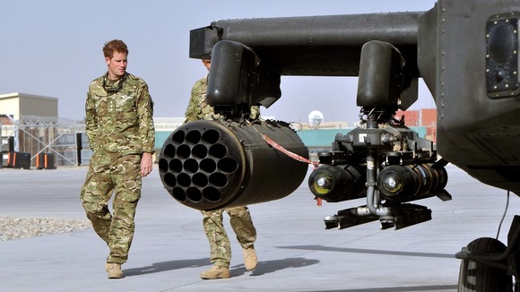 Prince Harry is shown the Apache flight-line by a member of his squadron on his arrival in Afghanistan.